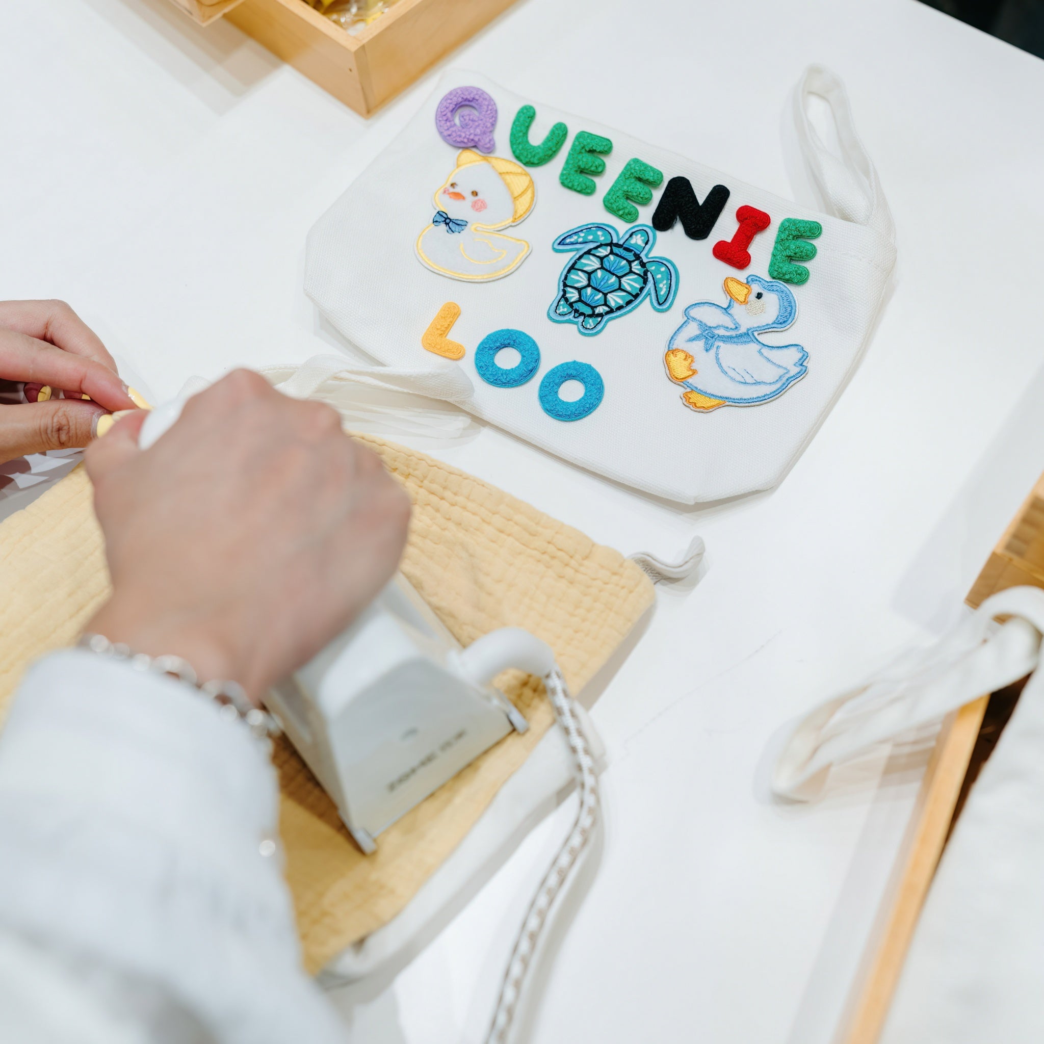Personalised Iron-On Pouches Station
